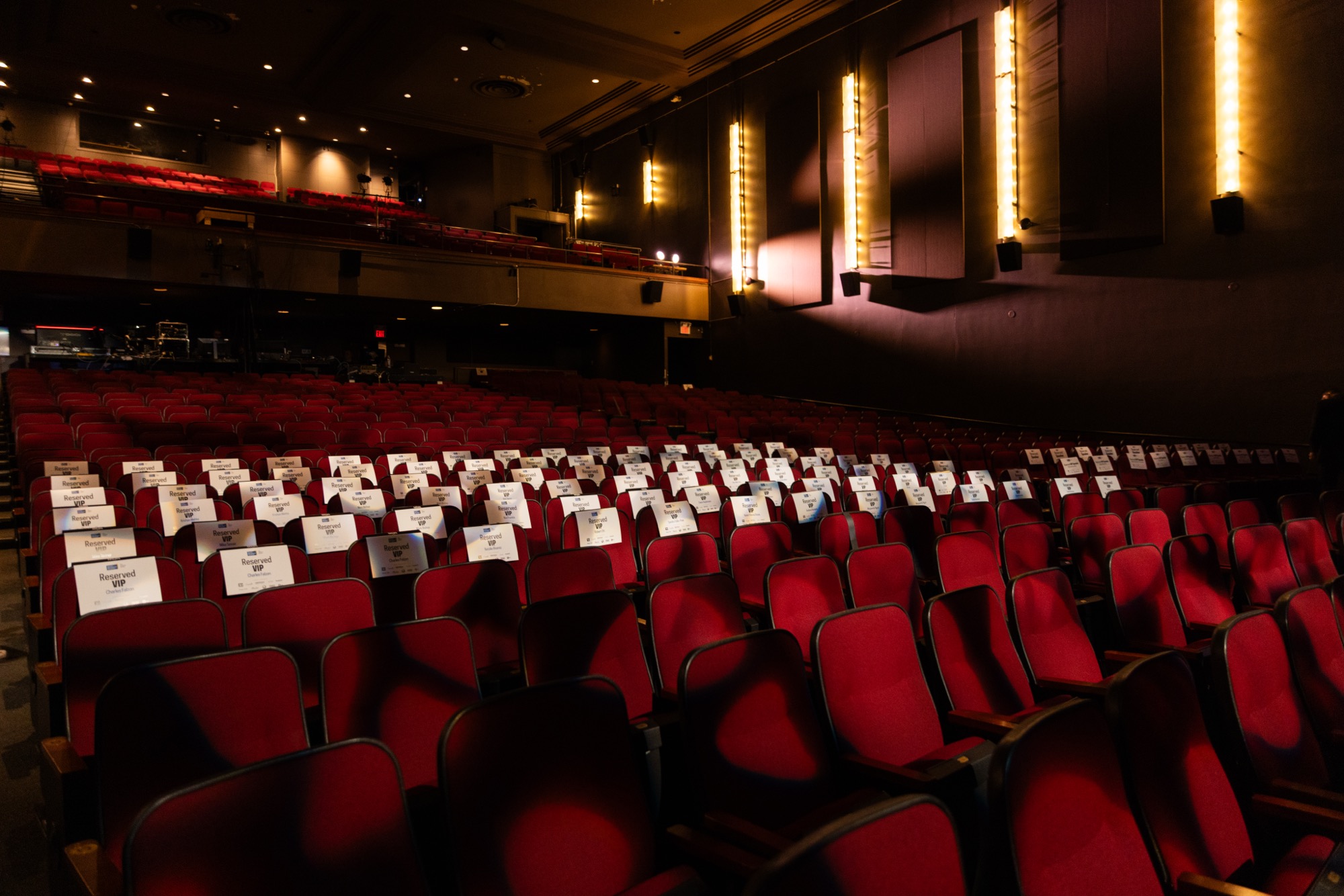 Reserved seat cards on the red velvet seats at Chrysalis